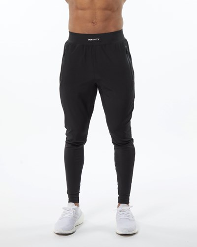 Alphalete Woven 4-Way Stretch 29" Pant Blackout | 0217-HLZFT